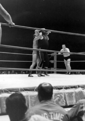 Bockwinkel has a full nelson on Bull Ramos