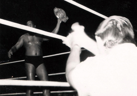 Steamboat holds up the Hawaiian Championship belt