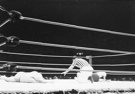 Referee Wally Tsutsumi counts Pat Patterson