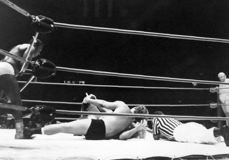 Nick Bockwinkel works on Buddy Austin's leg
