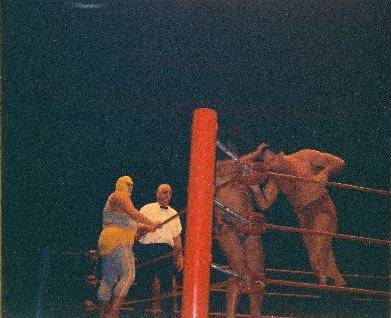 Peter Maivia works over Johnny Barend in the corner