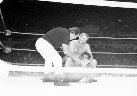 The Sheik applies the Camel Clutch on Morales