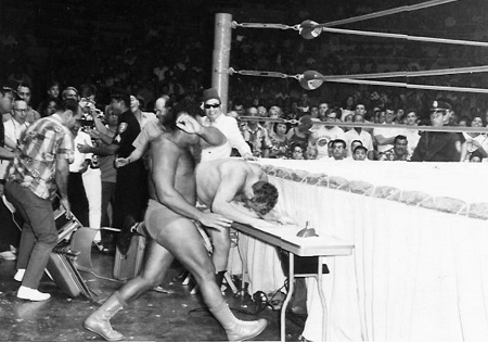 Pedro Morales slams the Sheik into the table